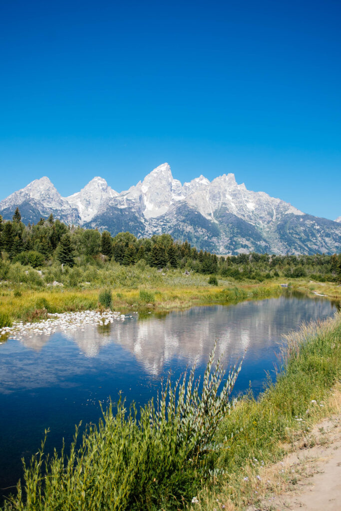 grand teton national park reflecting in lake